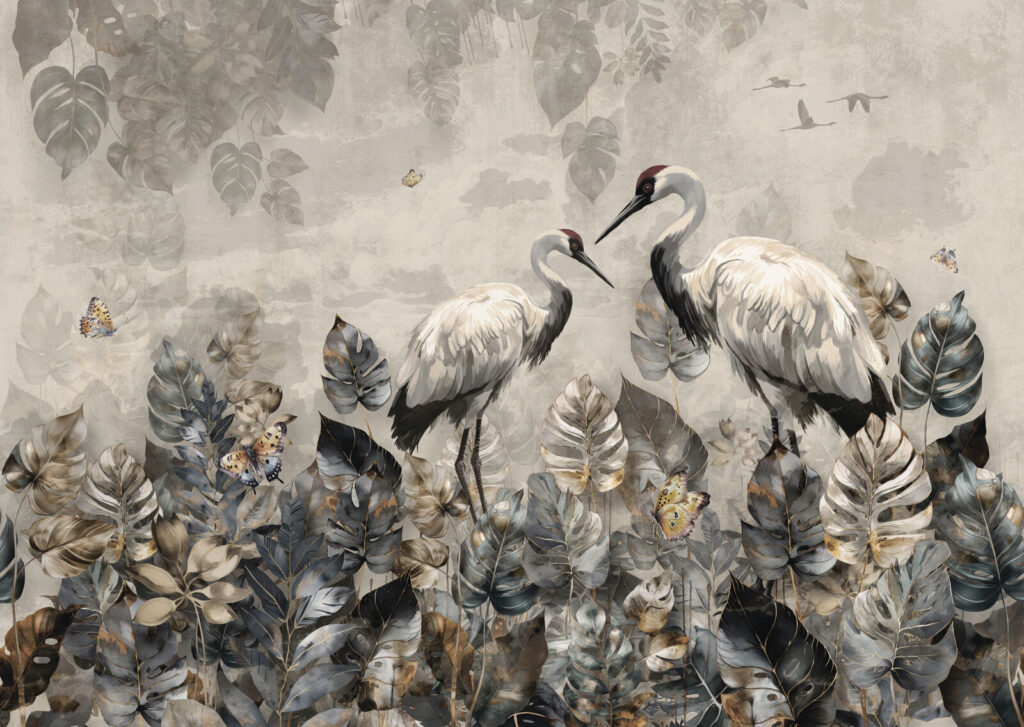 Couple of cranes standing in a field of leaves Couple of cranes standing in a field of leaves