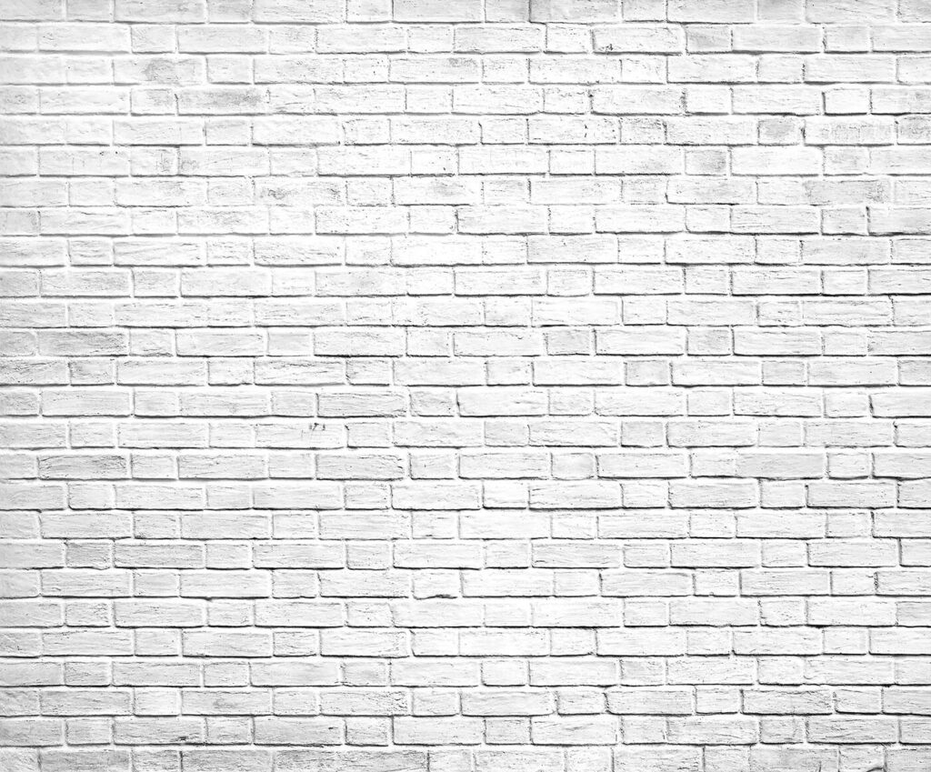 White brick wall with many small bricks White brick wall with many small bricks