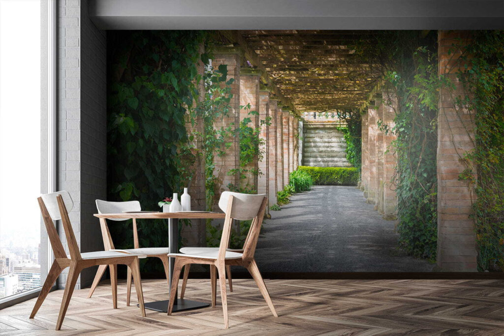 Walkway with stone pillars and vines