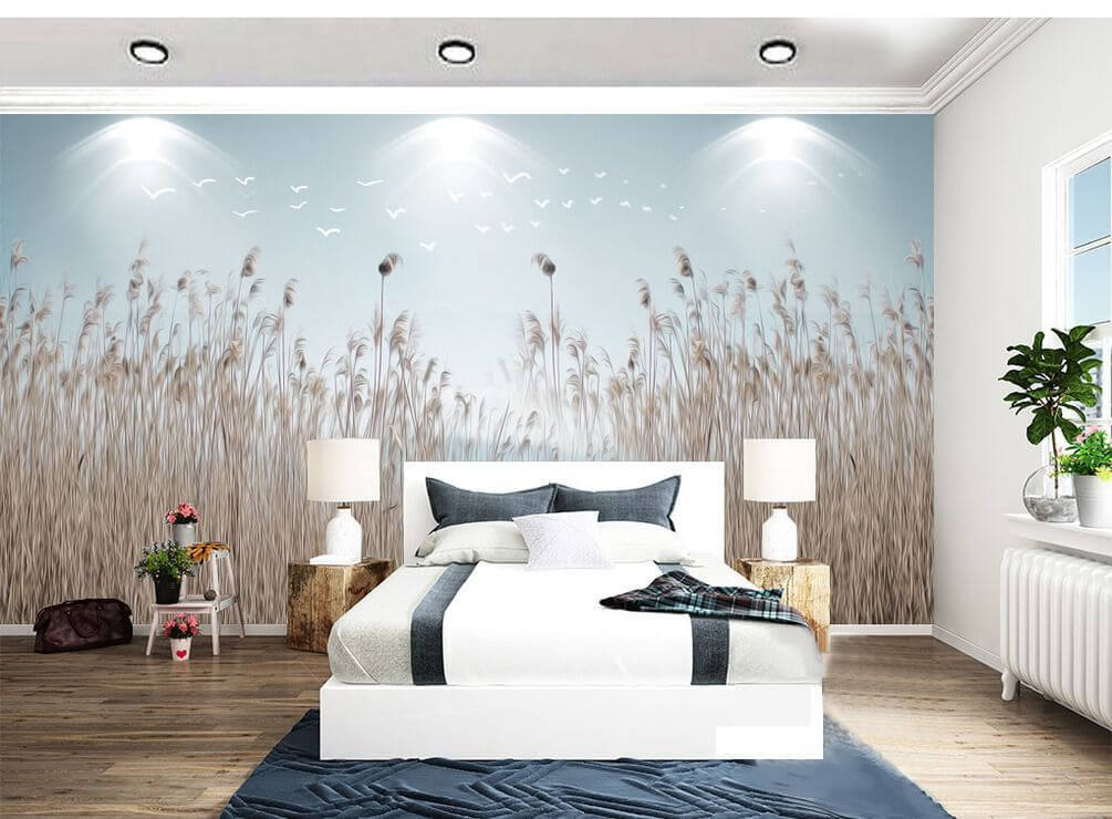 Group of tall grass with birds flying in the sky