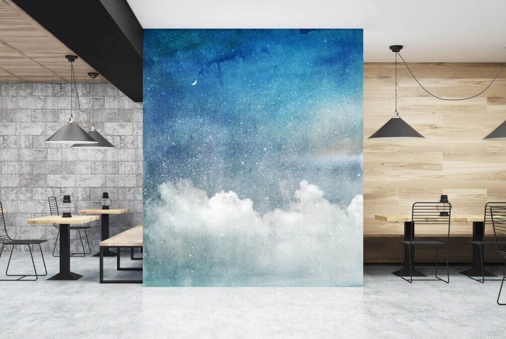 Blue sky with clouds and a crescent moon