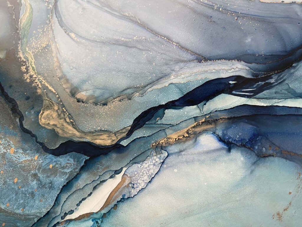 Swirling blues and earthy tones blend Swirling blues and earthy tones blend