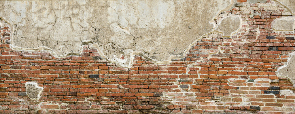 Brick wall with a cement wall