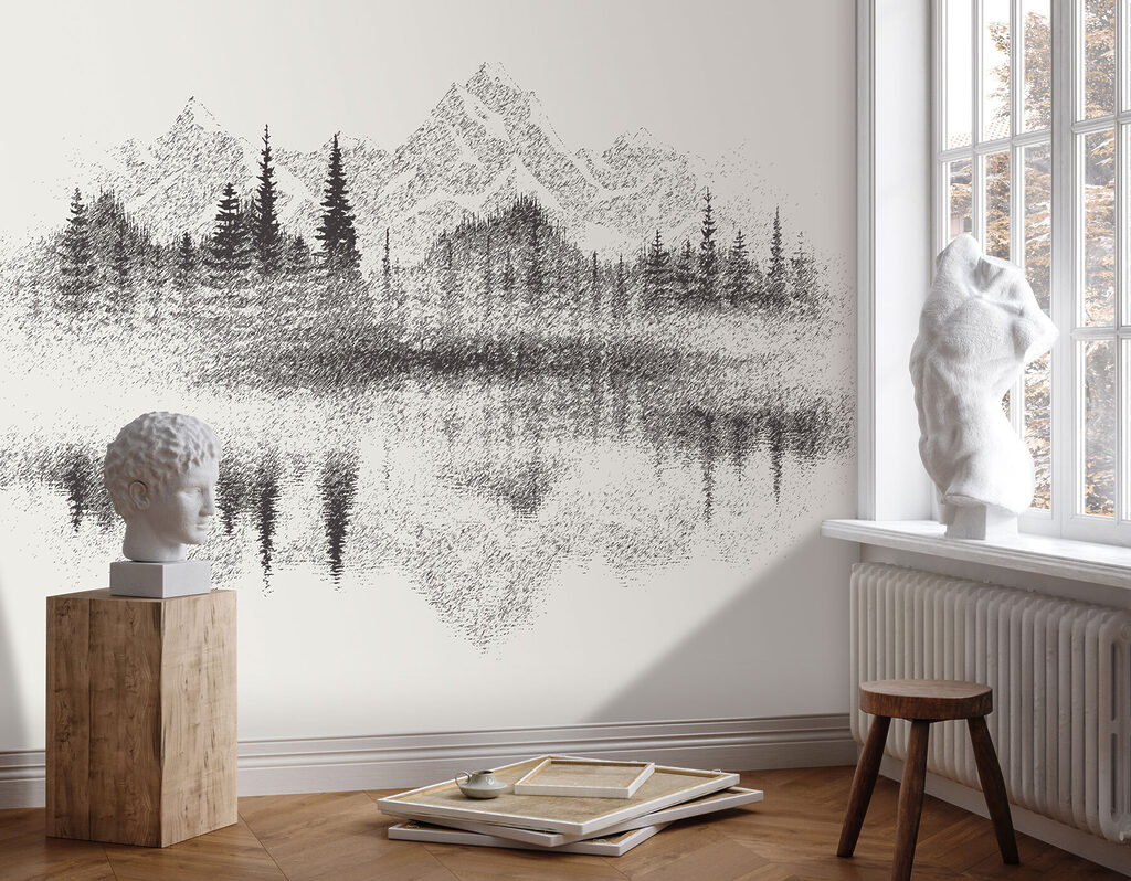 A mountain range and trees reflected in a lake