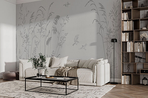 Birds flying over tall grass