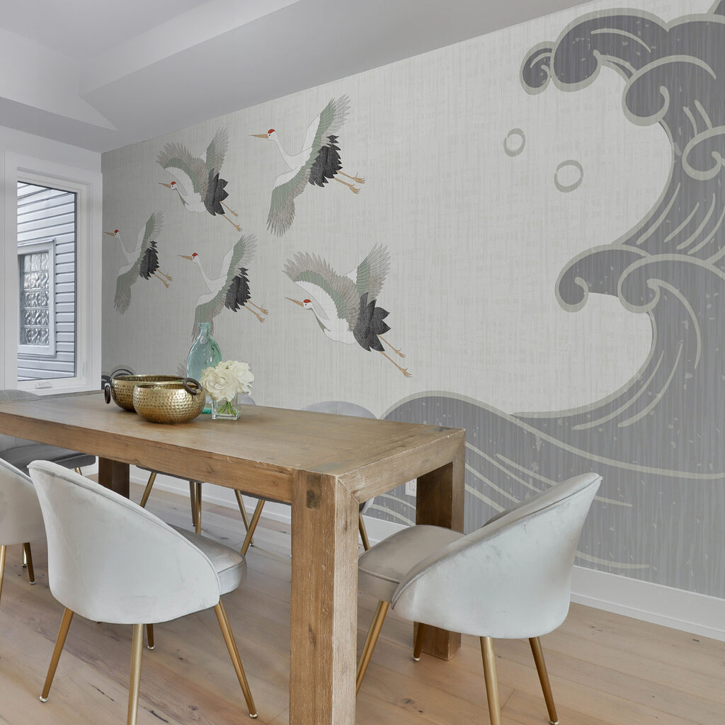 Group of birds flying over a wave