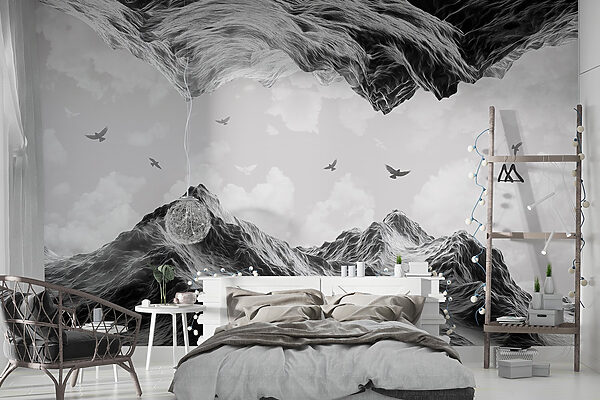 Group of birds flying over a mountain