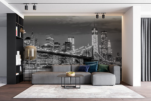 Bridge over water with city skyline at night