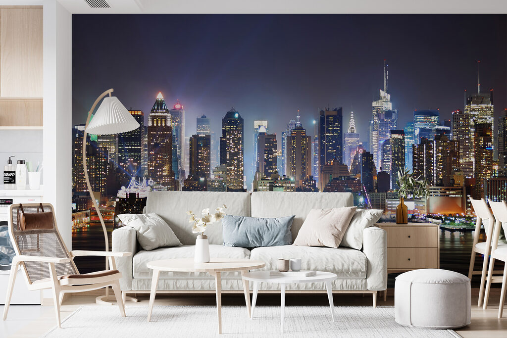 City skyline at night with lights reflecting on water