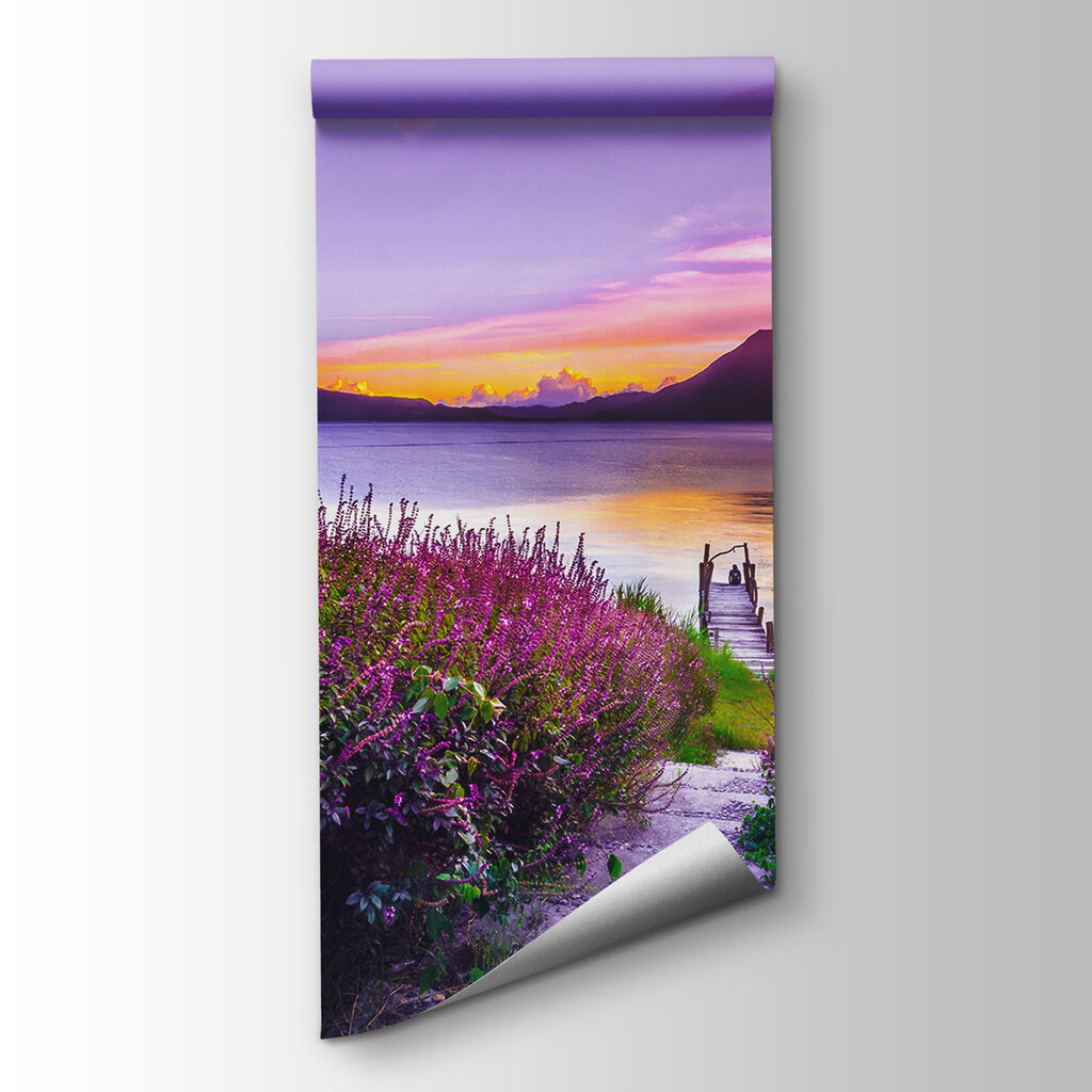 Path leading to a lake with purple flowers