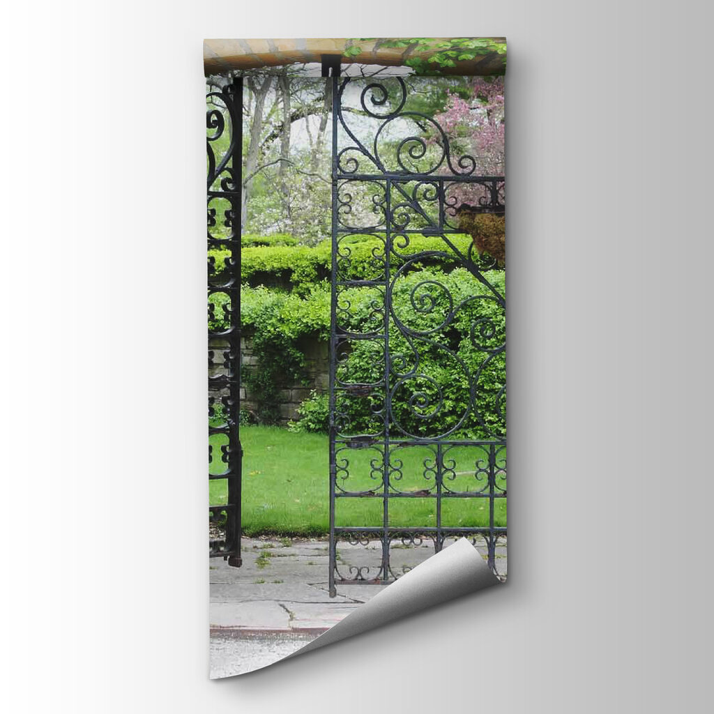 Gate with a stone arch and a green lawn
