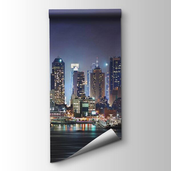 City skyline at night with lights reflecting on water