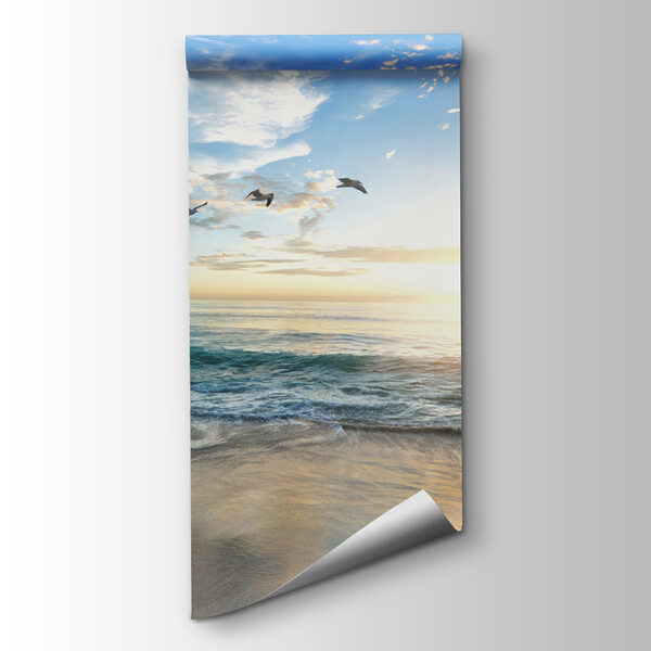 Beach with birds flying over the water Beach with birds flying over the water