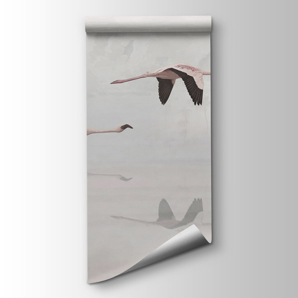 A group of flamingos flying over water