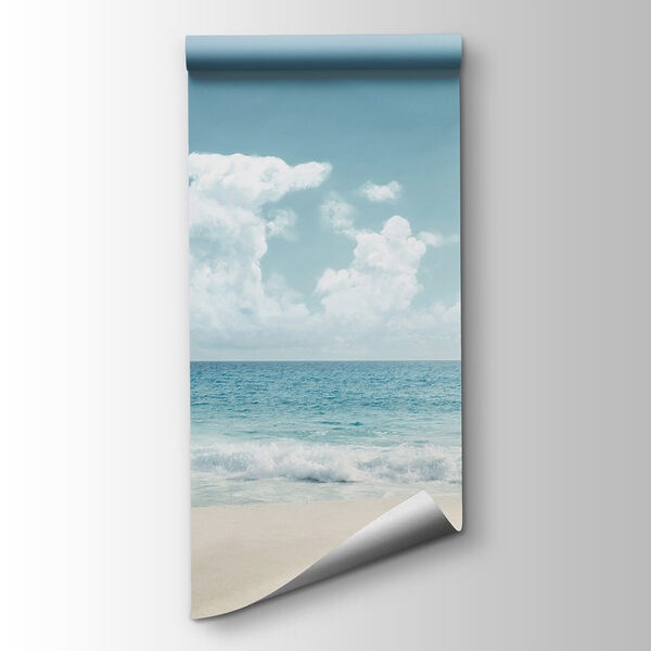 A beach with waves crashing on the sand