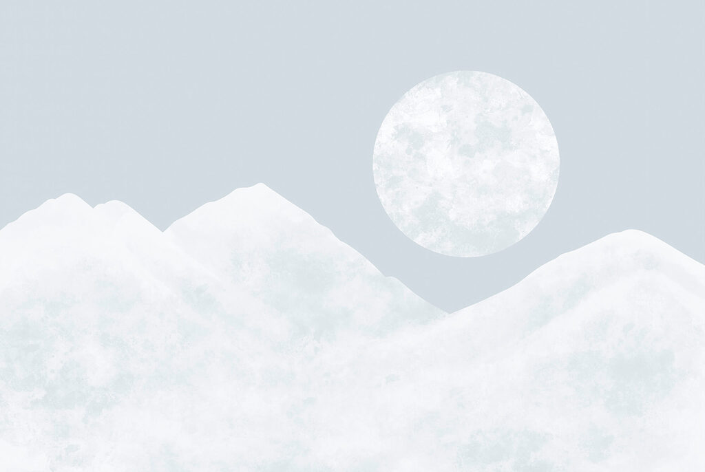 Moon over a snowy mountain